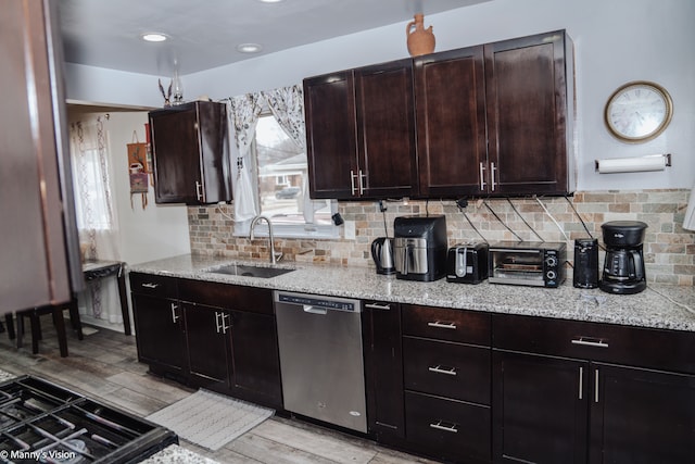 5324 Buchanan Ave, Warren, MI 48092 - kitchen with a toaster, a sink, stainless steel dishwasher, backsplash, and light stone countertops