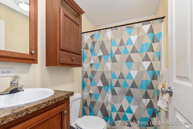 bathroom with a textured ceiling, vanity, toilet, and a shower with curtain