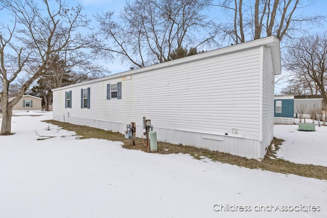 view of snow covered property