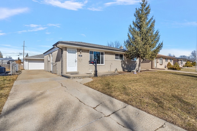 ranch-style home featuring cooling unit, a detached garage, an outdoor structure, fence, and a front yard