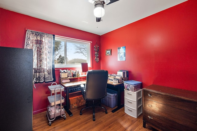 home office with ceiling fan and wood finished floors