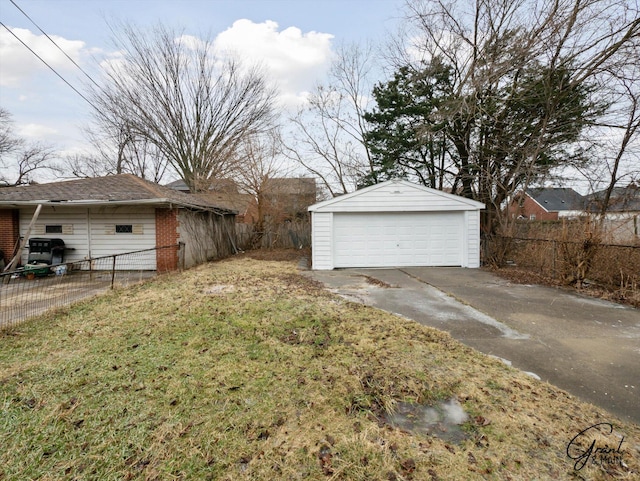 detached garage featuring fence