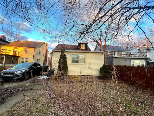 view of property exterior with fence