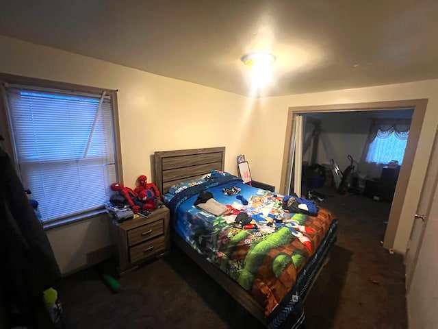 bedroom with dark carpet