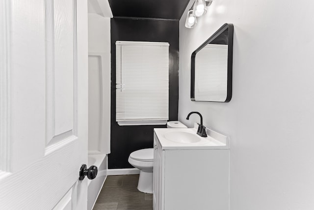 full bath with toilet, a bathing tub, vanity, baseboards, and walk in shower