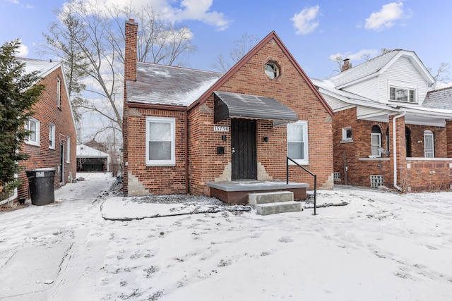 bungalow-style home featuring brick siding