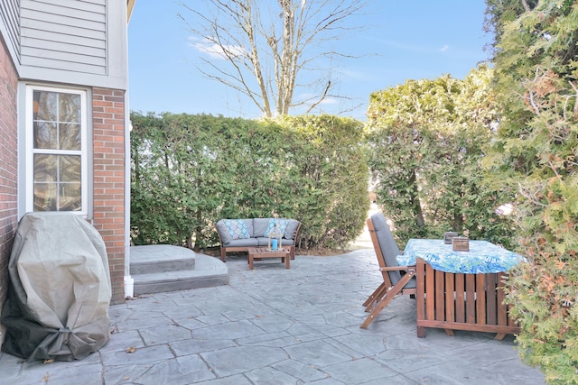 view of patio featuring an outdoor living space, area for grilling, and outdoor dining area