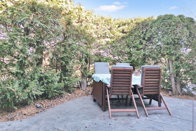 view of patio featuring outdoor dining area