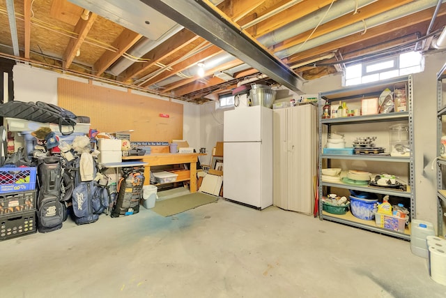 basement with freestanding refrigerator