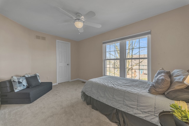 bedroom featuring visible vents, carpet flooring, baseboards, and ceiling fan