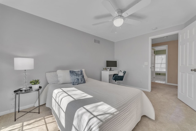 carpeted bedroom featuring visible vents, ceiling fan, and baseboards