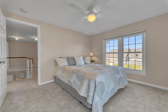 bedroom with carpet flooring, ceiling fan, and baseboards