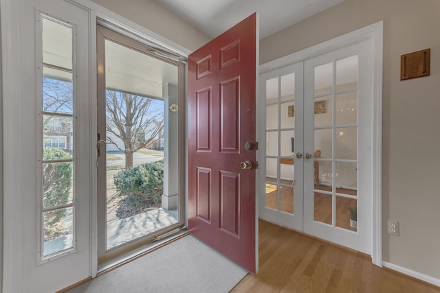 entrance foyer with french doors and wood finished floors