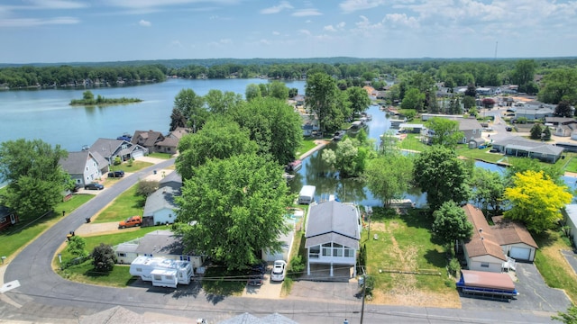 drone / aerial view featuring a residential view and a water view