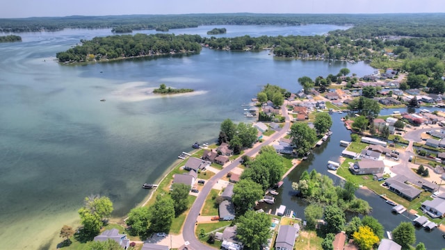 bird's eye view featuring a water view and a residential view