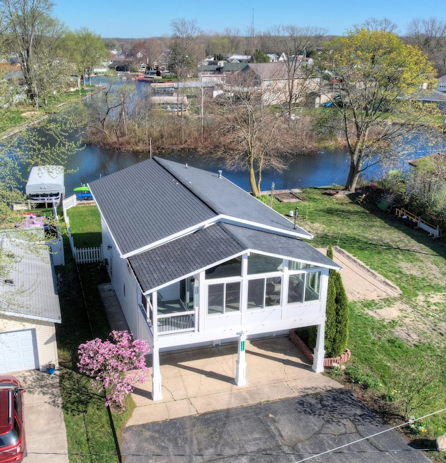 birds eye view of property featuring a water view