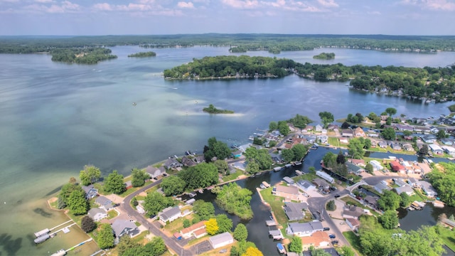 drone / aerial view featuring a water view and a residential view