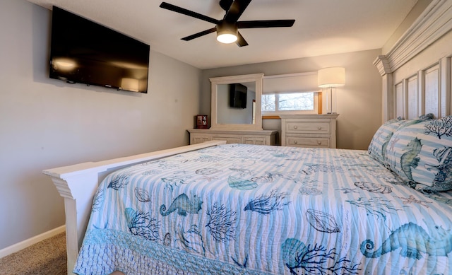 bedroom featuring ceiling fan, carpet, and baseboards