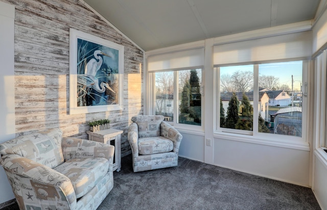 sunroom / solarium featuring lofted ceiling