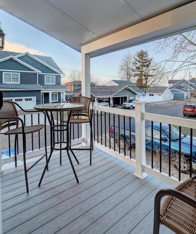 wooden deck with a residential view