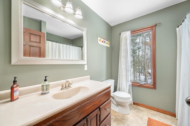 full bath featuring toilet, tile patterned floors, baseboards, and vanity