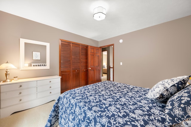 bedroom featuring a closet and carpet flooring