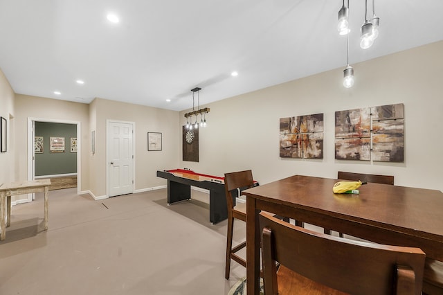 recreation room with baseboards, concrete floors, and recessed lighting