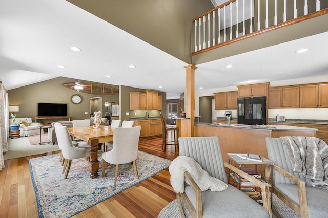 dining area featuring ceiling fan, high vaulted ceiling, light wood-type flooring, and recessed lighting