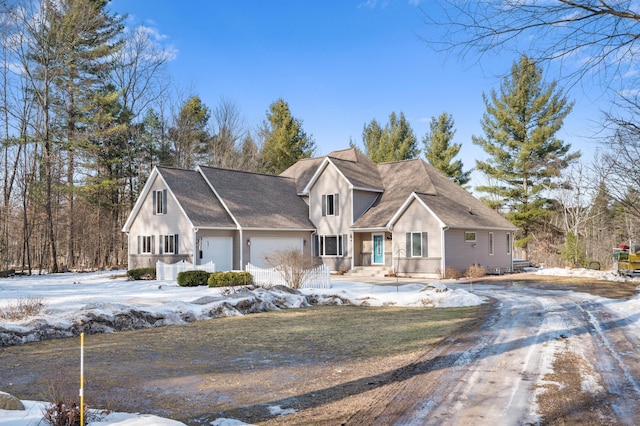 view of front of property featuring driveway and an attached garage