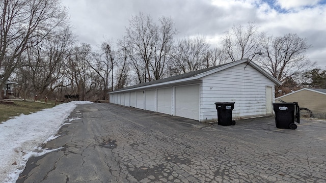 exterior space with community garages and an outdoor structure