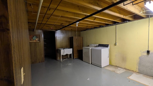 unfinished basement featuring washer and clothes dryer