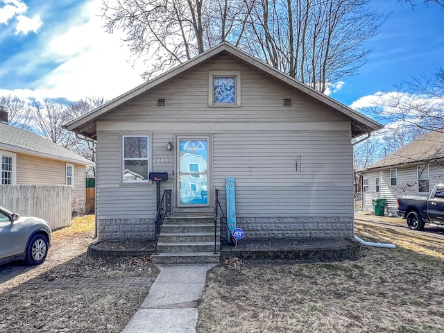 bungalow-style home with entry steps