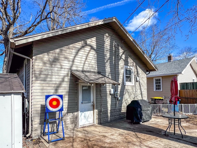 back of property with fence