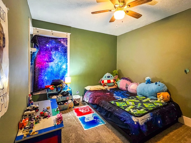 carpeted bedroom featuring a ceiling fan