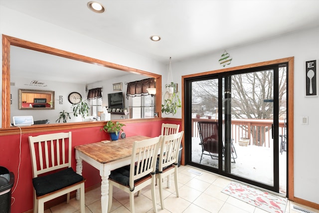 tiled dining space featuring visible vents and recessed lighting