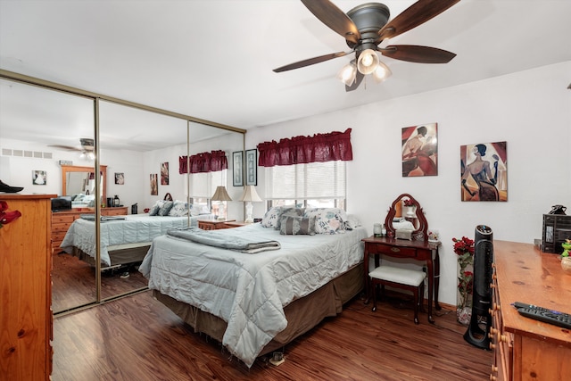 bedroom with ceiling fan, a closet, and wood finished floors