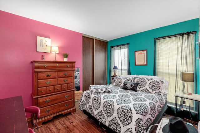 bedroom featuring wood finished floors