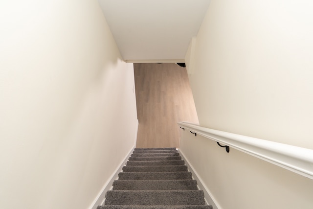 stairway featuring baseboards