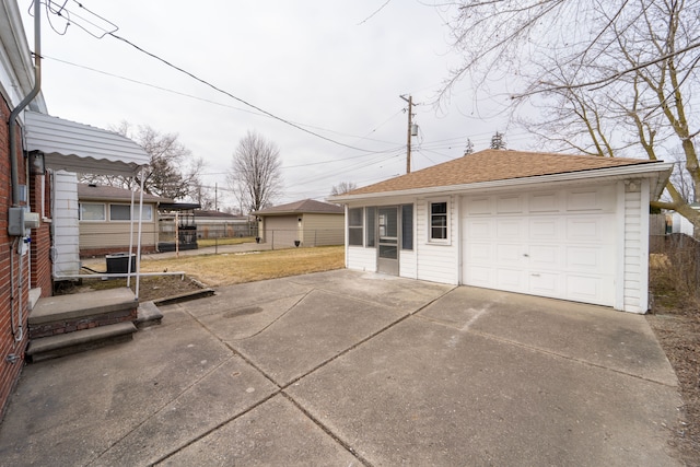 exterior space with driveway and fence