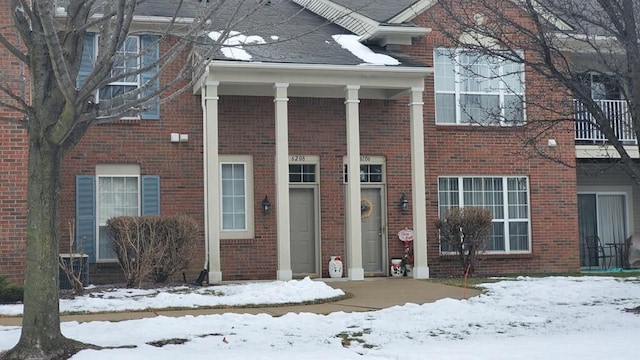 exterior space with brick siding