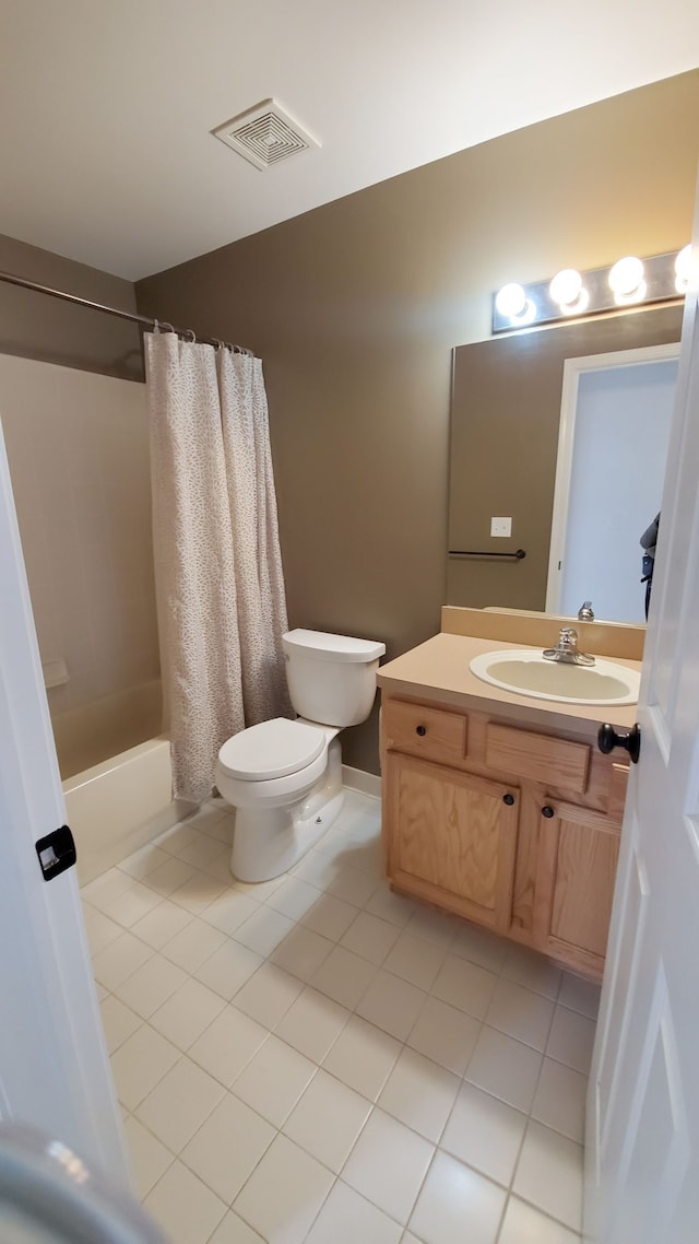 full bathroom featuring tile patterned floors, visible vents, toilet, and vanity