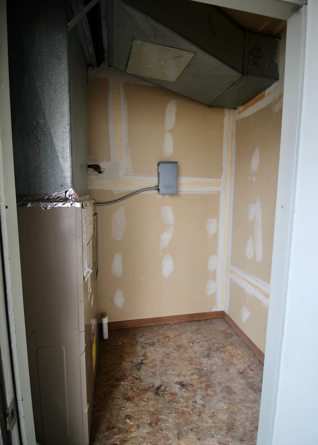 utility room with heating unit