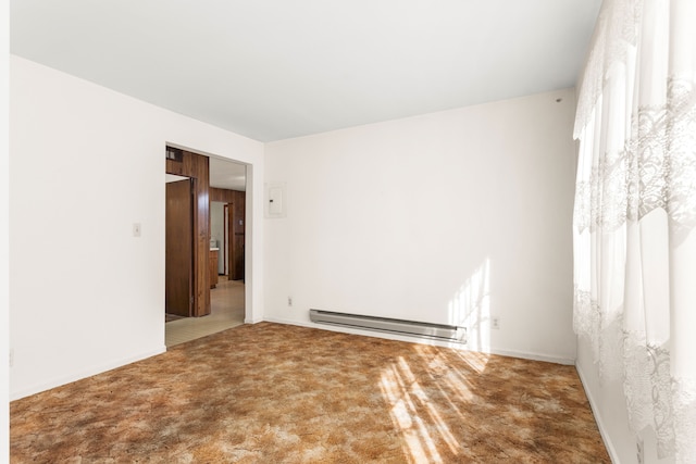 unfurnished room with carpet flooring and baseboard heating