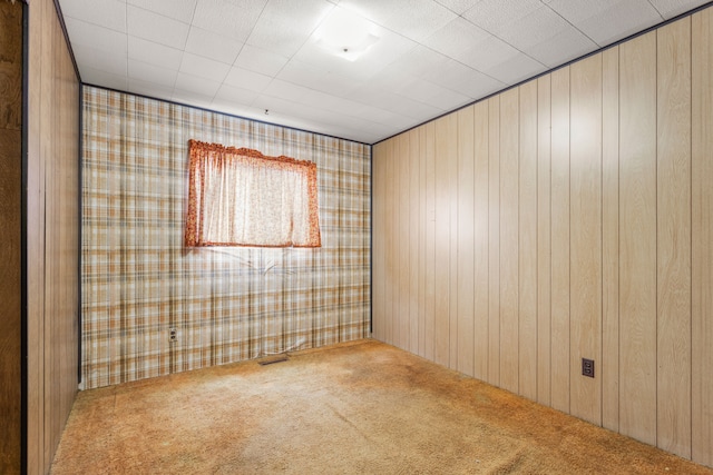 spare room featuring carpet floors and visible vents