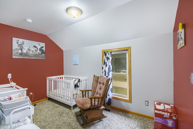 carpeted bedroom with lofted ceiling, a nursery area, and baseboards