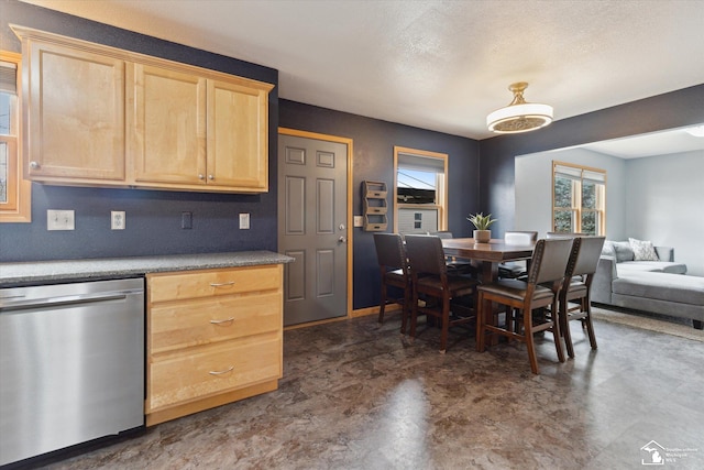 kitchen with a textured ceiling, light brown cabinets, baseboards, open floor plan, and stainless steel dishwasher