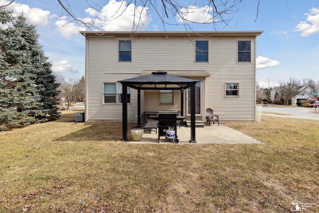 back of property featuring a gazebo, a yard, a patio, and cooling unit