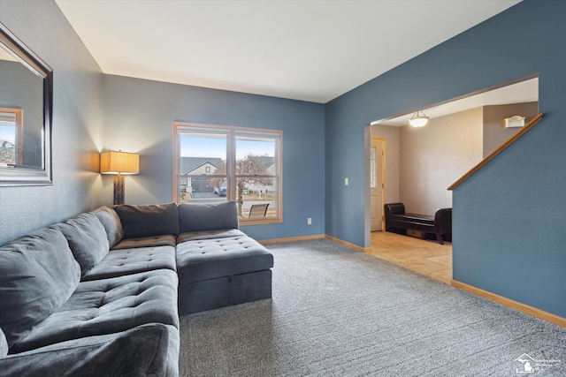 living area with carpet flooring and baseboards