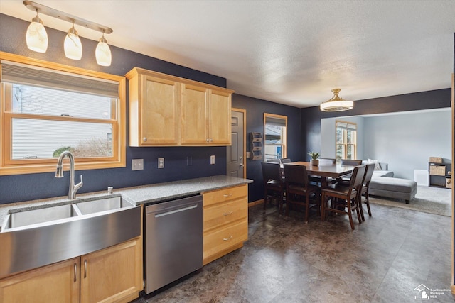 kitchen featuring light countertops, light brown cabinets, a sink, concrete flooring, and dishwasher