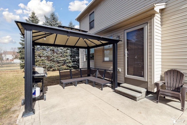 view of patio / terrace with area for grilling and a gazebo